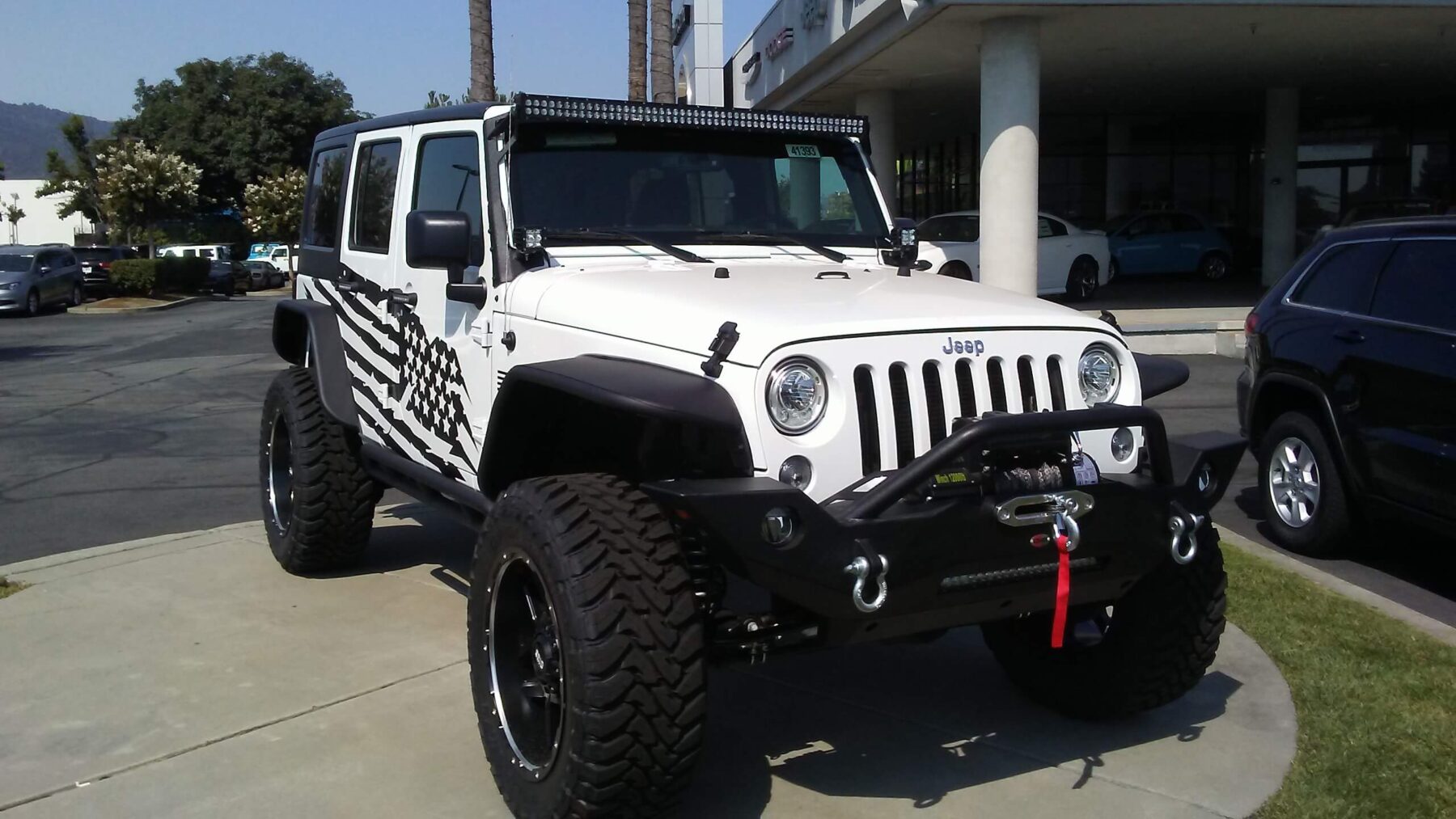 Jeep Wrangler with lift kit and aftermarket wheels